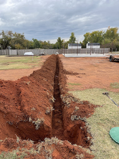 A pile of dirt sitting in the middle of a field