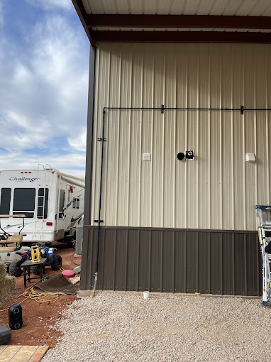 A couple of trucks parked in front of a building