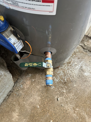 A close up of a gas tank with a hose connected to it